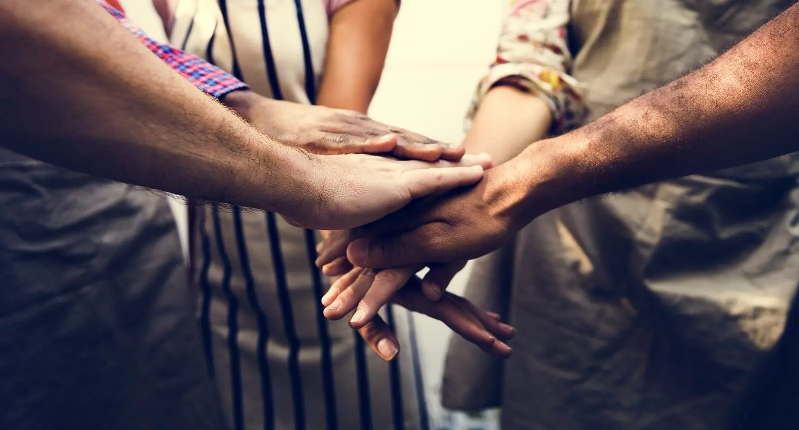 hands | adult iop in houston, tx | adult intensive outpatient program in houston, tx | iop for depression | adult outpatient program | 77022 | 77024 | 77057 Image of men and women putting their hands on top of each other. Find support battling your anxiety or depression with the help of adult intensive outpatient programs in Houston, TX.