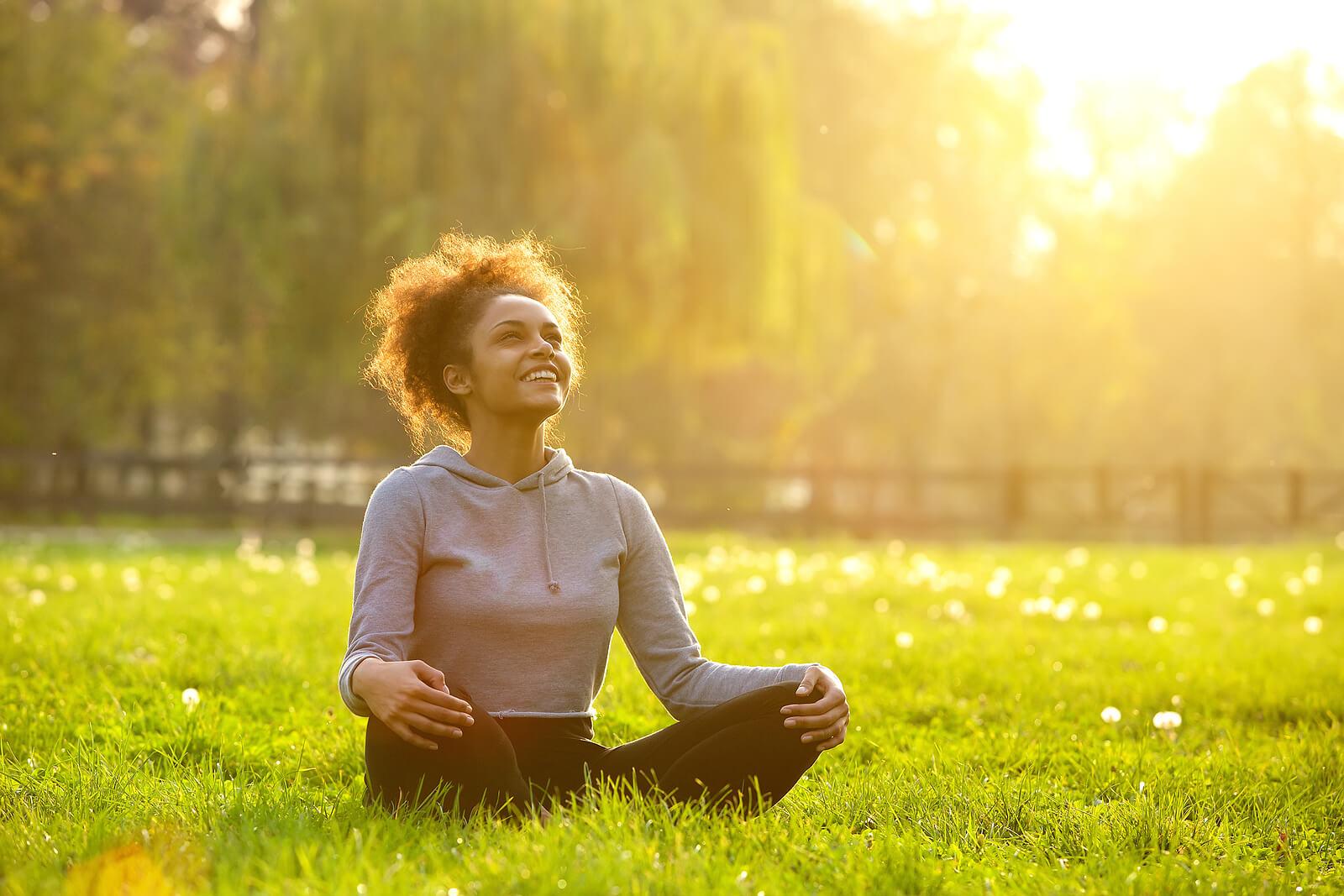 happy woman sitting in grass | adult iop in houston, tx | adult intensive outpatient program in houston, tx | intensive outpatient program houston | adult outpatient program | 77056 | 77005 | 77006 Image of a happy woman sitting on the ground looking up toward the sky. With the help of a skilled therapist, you can begin to improve your impulse control and decision making skills with the help of DBT used in an Adult IOP in Houston, TX.