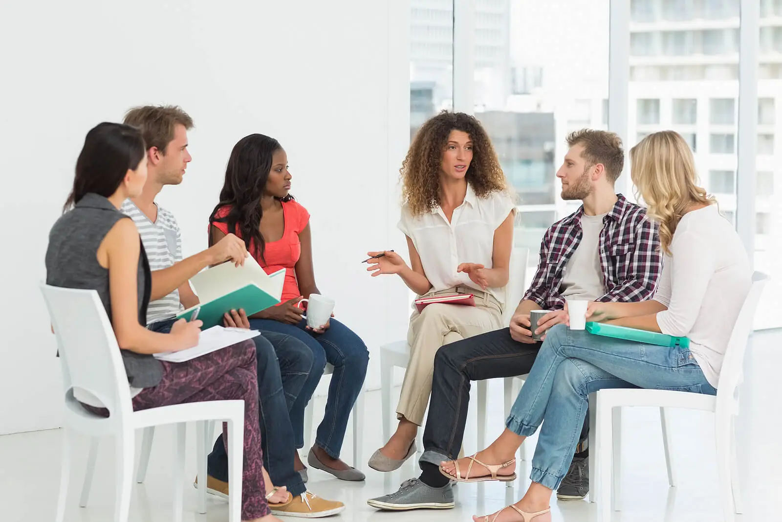 group therapy | adult iop in houston, tx | adult intensive outpatient program in houston, tx | intensive outpatient program houston | adult outpatient program | 77007 | 77055 | 77057 Image of a group of people sitting in a circle in group therapy. In an adult intensive outpatient program in Houston, TX you can learn DBT skills to help you with impulse control and decision-making.