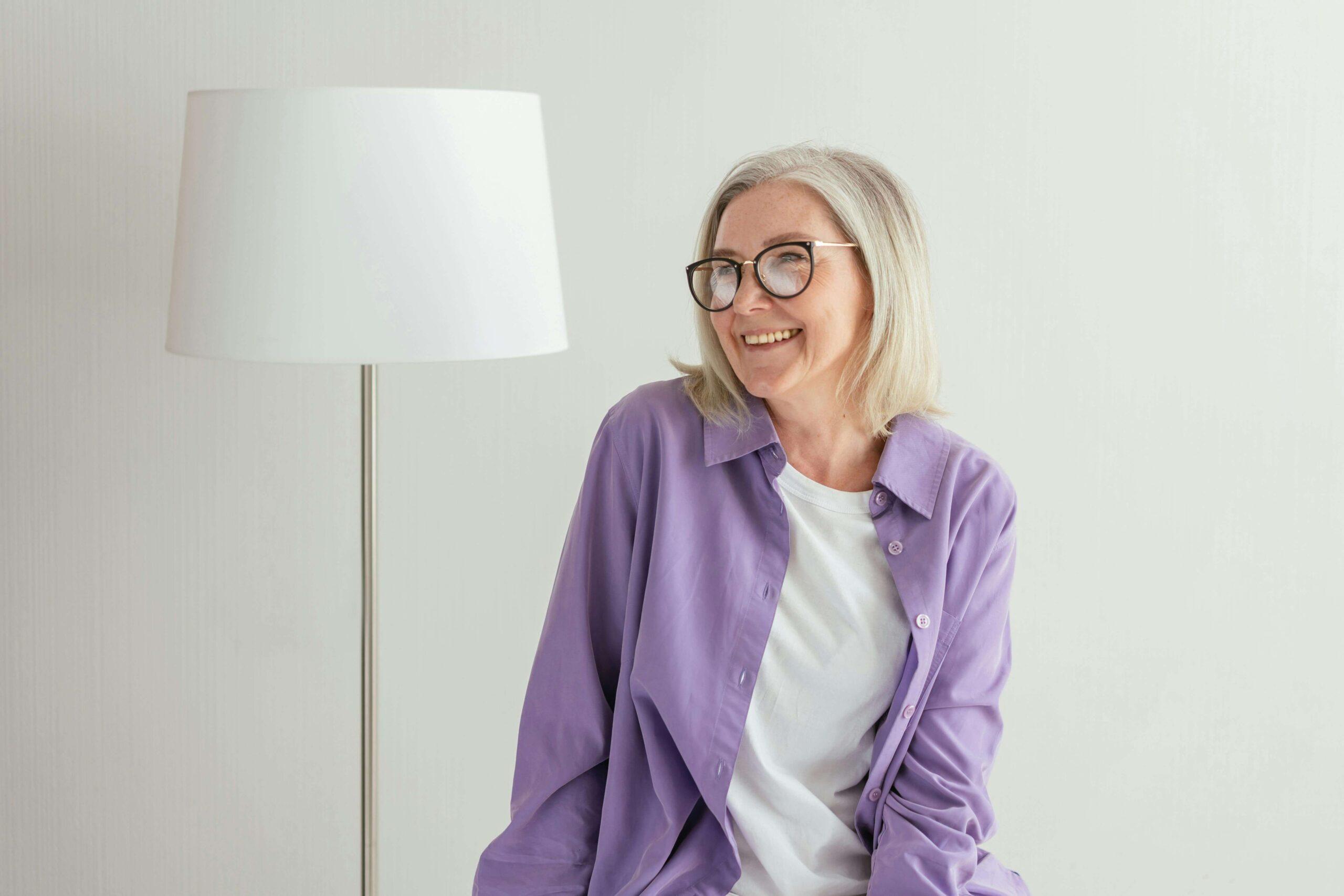 happy mature woman | adult iop in houston, tx | adult intensive outpatient program in houston, tx | intensive outpatient program houston | iop program houston | 77008 | 77009 | 77018 Smiling mature woman wearing a purple shirt. Begin healing and overcoming the negative unhealthy patterns keeping you from moving forward with an adult IOP in Houston, TX.
