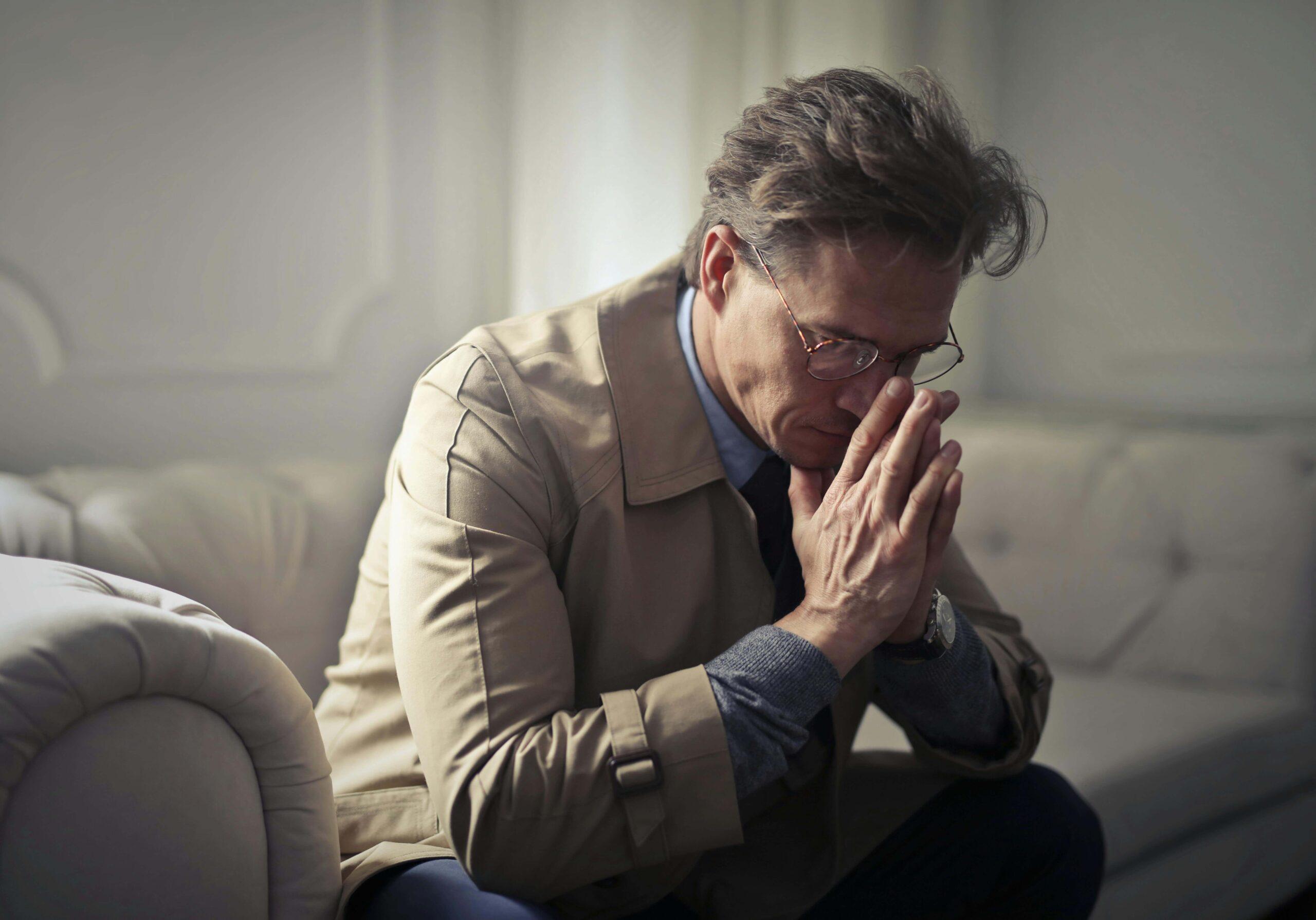 stressed man | adult intensive outpatient program in houston, tx | adult iop | intensive outpatient program houston | adult outpatient program | 77008 | 77009 | 77018 Image of a stressed man sitting on a couch leaning forward with his hands covering his mouth. If you struggle with self harm, find support with an adult intensive outpatient program in Houston, TX to help you cope.