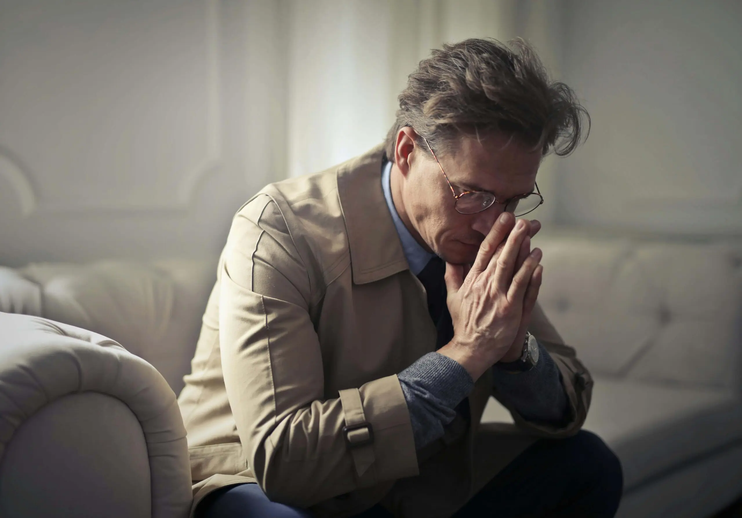 stressed man | adult intensive outpatient program in houston, tx | adult iop | intensive outpatient program houston | adult outpatient program | 77008 | 77009 | 77018 Image of a stressed man sitting on a couch leaning forward with his hands covering his mouth. If you struggle with self harm, find support with an adult intensive outpatient program in Houston, TX to help you cope.