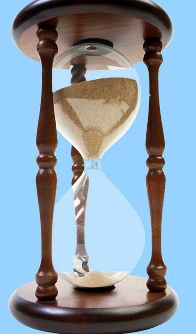 hour glass with sand flowing down